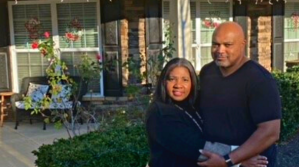 couple in front of home