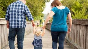 family walking bridge