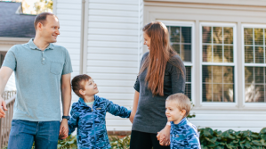 Family in front of their home