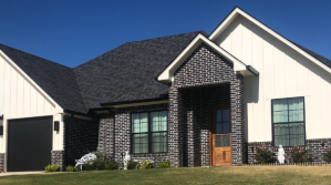 Ranch-style home featuring a two-car garage.