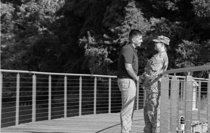 Couple standing on bridge